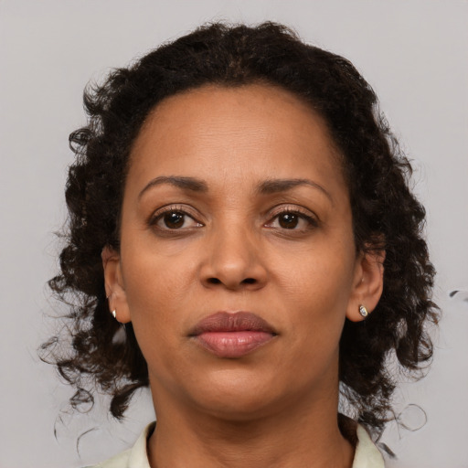 Neutral black adult female with medium  brown hair and brown eyes