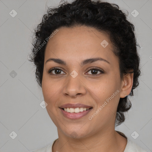 Joyful latino young-adult female with short  brown hair and brown eyes