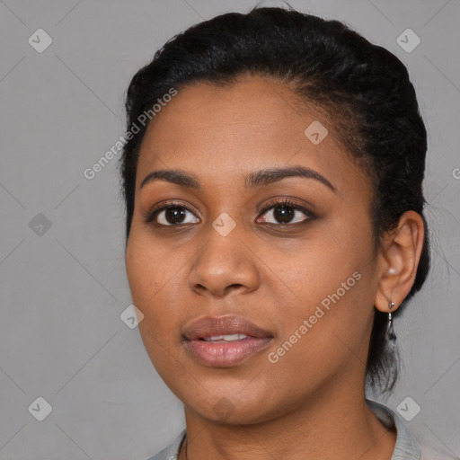 Joyful black young-adult female with medium  black hair and brown eyes