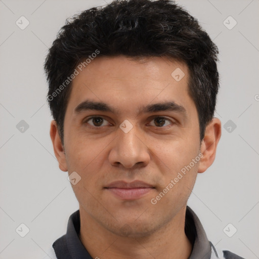 Joyful white young-adult male with short  black hair and brown eyes