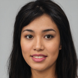 Joyful asian young-adult female with long  brown hair and brown eyes