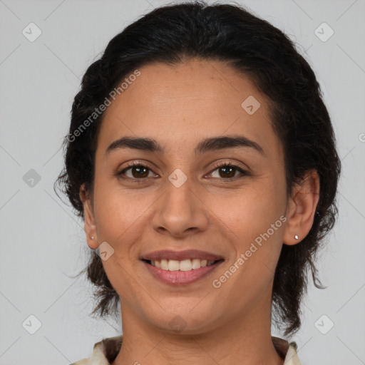 Joyful latino young-adult female with medium  brown hair and brown eyes