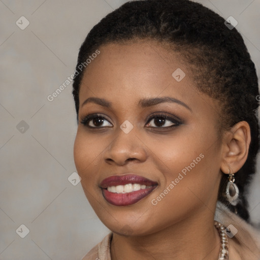 Joyful black young-adult female with long  brown hair and brown eyes