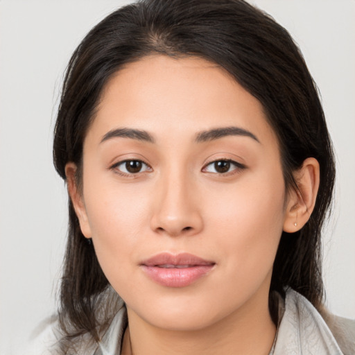 Joyful asian young-adult female with medium  brown hair and brown eyes