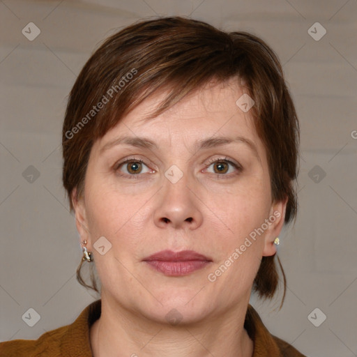 Joyful white adult female with medium  brown hair and grey eyes