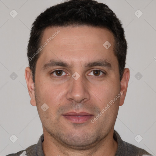 Joyful white adult male with short  brown hair and brown eyes