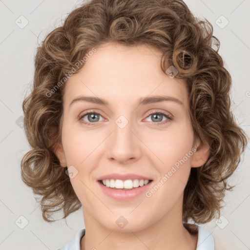 Joyful white young-adult female with medium  brown hair and green eyes