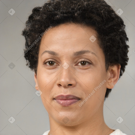 Joyful black adult female with short  brown hair and brown eyes