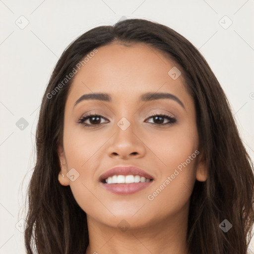 Joyful latino young-adult female with long  brown hair and brown eyes