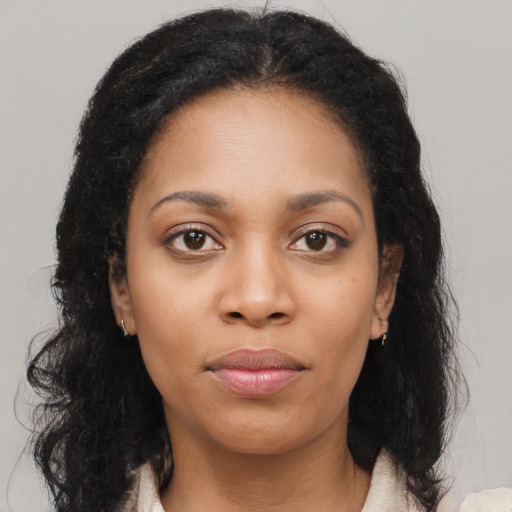 Neutral black young-adult female with long  brown hair and brown eyes