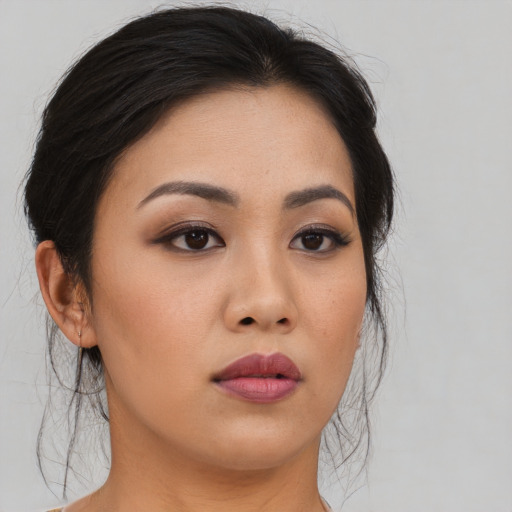 Neutral asian young-adult female with medium  brown hair and brown eyes