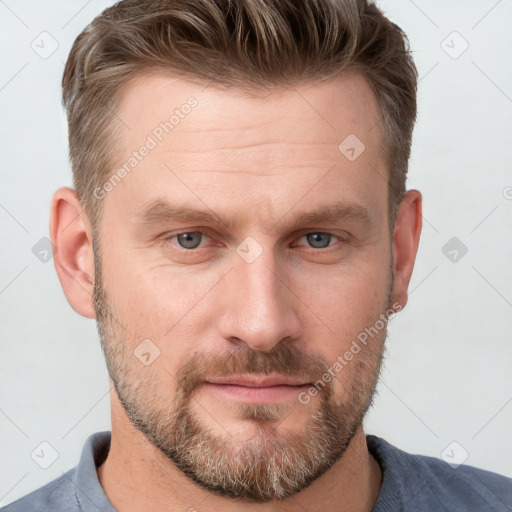 Joyful white adult male with short  brown hair and grey eyes