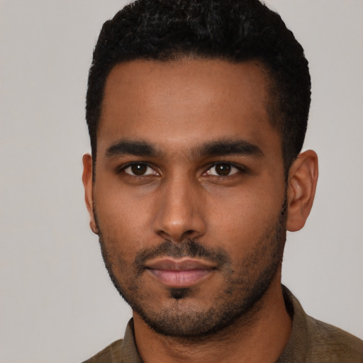 Neutral latino young-adult male with short  black hair and brown eyes