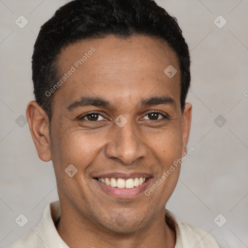 Joyful latino young-adult male with short  black hair and brown eyes