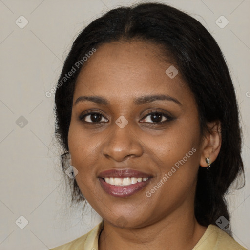 Joyful black young-adult female with medium  black hair and brown eyes