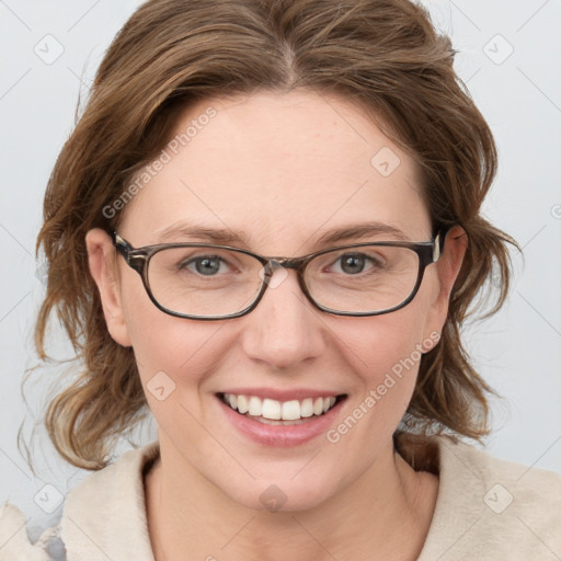 Joyful white young-adult female with medium  brown hair and blue eyes