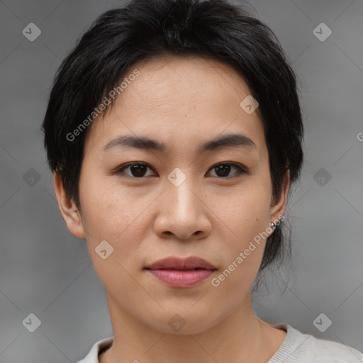 Joyful asian young-adult female with medium  brown hair and brown eyes