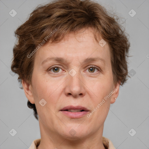 Joyful white adult female with short  brown hair and grey eyes