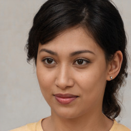 Joyful white young-adult female with medium  brown hair and brown eyes