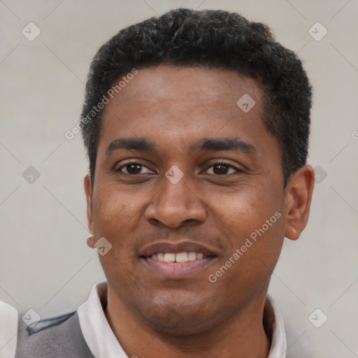 Joyful latino young-adult male with short  brown hair and brown eyes