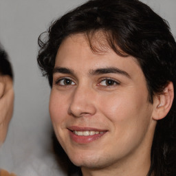 Joyful white young-adult male with medium  brown hair and brown eyes