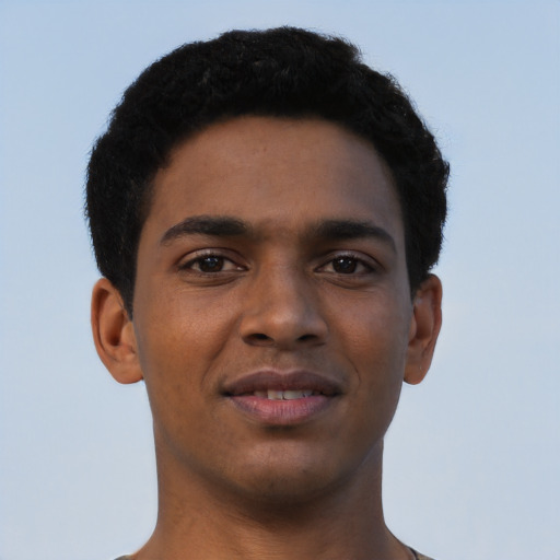 Joyful black young-adult male with short  brown hair and brown eyes