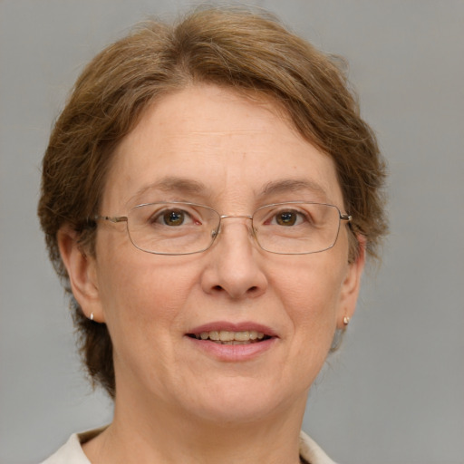 Joyful white middle-aged female with medium  brown hair and green eyes