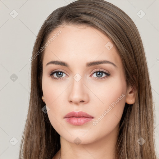 Neutral white young-adult female with long  brown hair and brown eyes