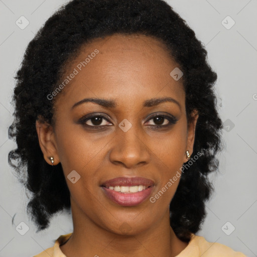 Joyful black young-adult female with long  brown hair and brown eyes