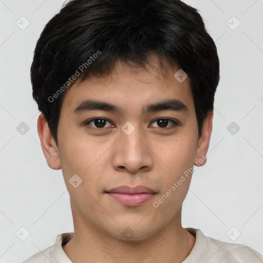 Joyful asian young-adult male with short  brown hair and brown eyes