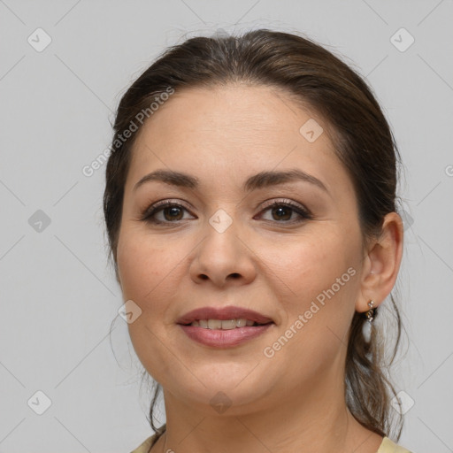 Joyful white adult female with medium  brown hair and brown eyes