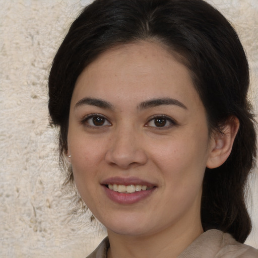 Joyful white young-adult female with medium  brown hair and brown eyes