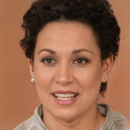 Joyful white adult female with short  brown hair and brown eyes