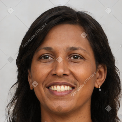 Joyful white adult female with long  brown hair and brown eyes