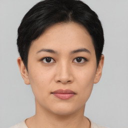 Joyful asian young-adult female with short  black hair and brown eyes