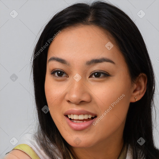 Joyful asian young-adult female with long  brown hair and brown eyes