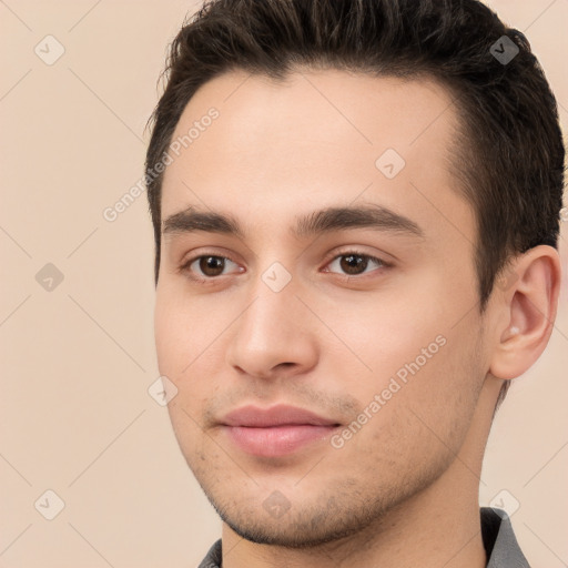 Joyful white young-adult male with short  brown hair and brown eyes