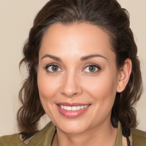 Joyful white young-adult female with medium  brown hair and brown eyes