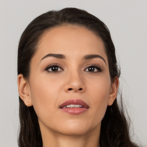 Joyful white young-adult female with long  brown hair and brown eyes