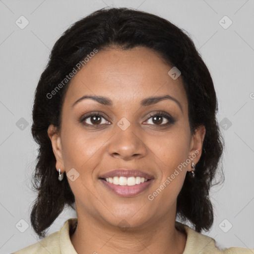 Joyful black young-adult female with medium  brown hair and brown eyes