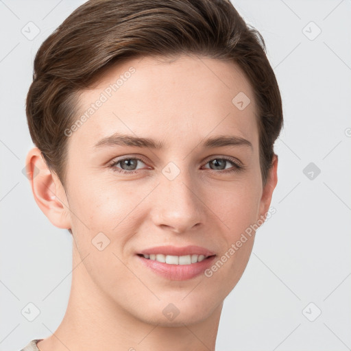 Joyful white young-adult female with short  brown hair and grey eyes