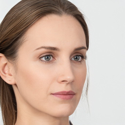 Neutral white young-adult female with long  brown hair and grey eyes