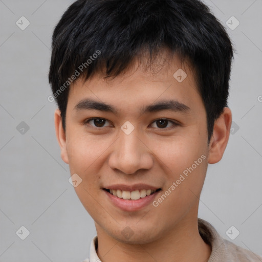 Joyful asian young-adult male with short  brown hair and brown eyes