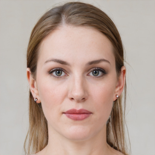 Joyful white young-adult female with medium  brown hair and grey eyes