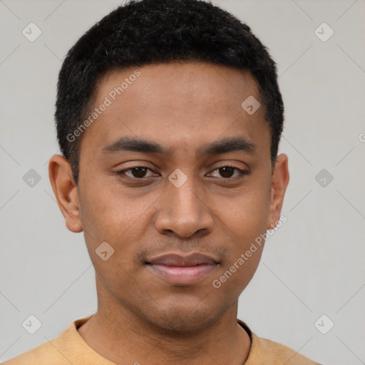 Joyful latino young-adult male with short  black hair and brown eyes