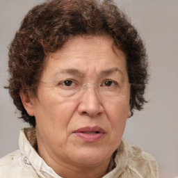 Joyful white middle-aged female with medium  brown hair and brown eyes