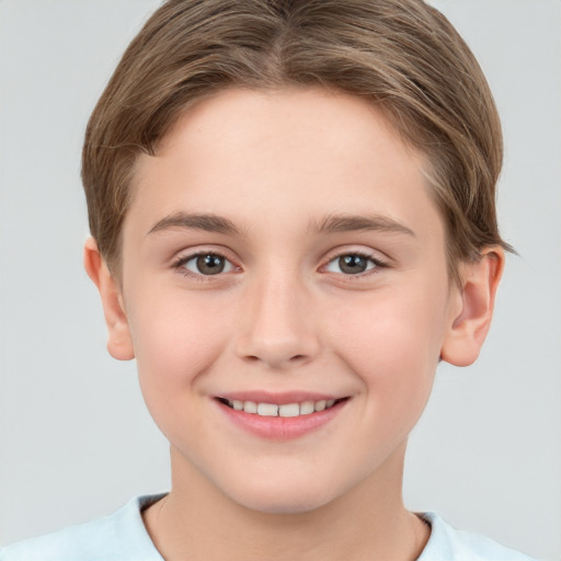 Joyful white child female with short  brown hair and brown eyes