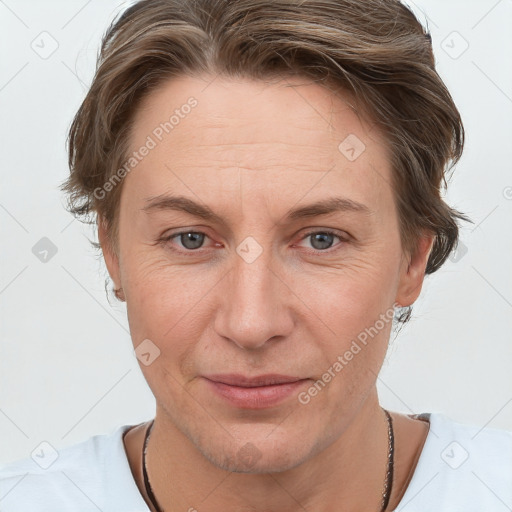 Joyful white adult female with short  brown hair and grey eyes