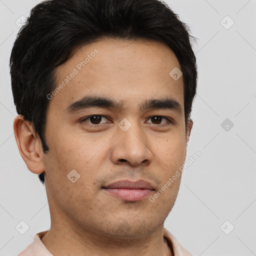 Joyful latino young-adult male with short  brown hair and brown eyes