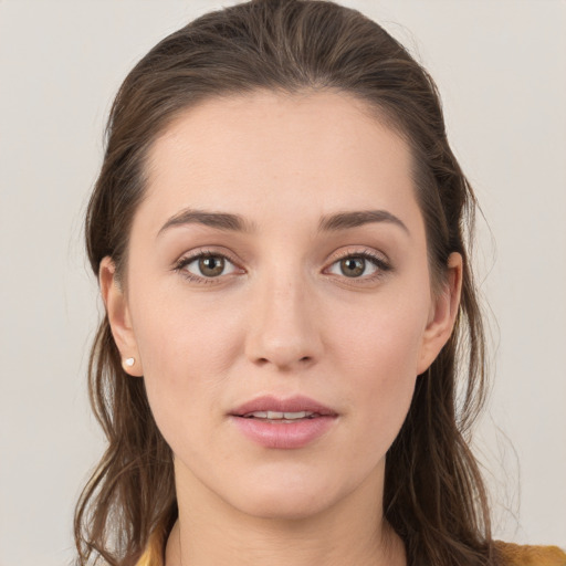 Joyful white young-adult female with long  brown hair and grey eyes